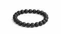 Black beaded bracelet on a white background with 'Maia Crystals' branding.